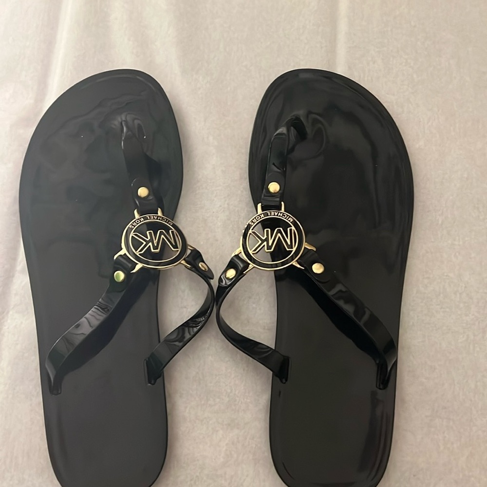 Gently used Michael Kors MK logo Charm Black Thong patent jelly sandals size 9